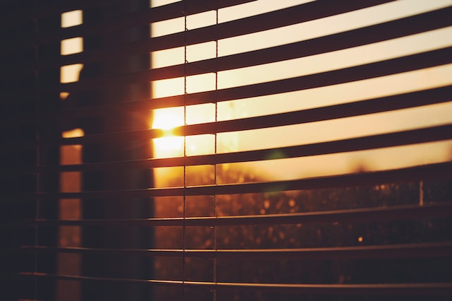 sunlight beaming through window blinds